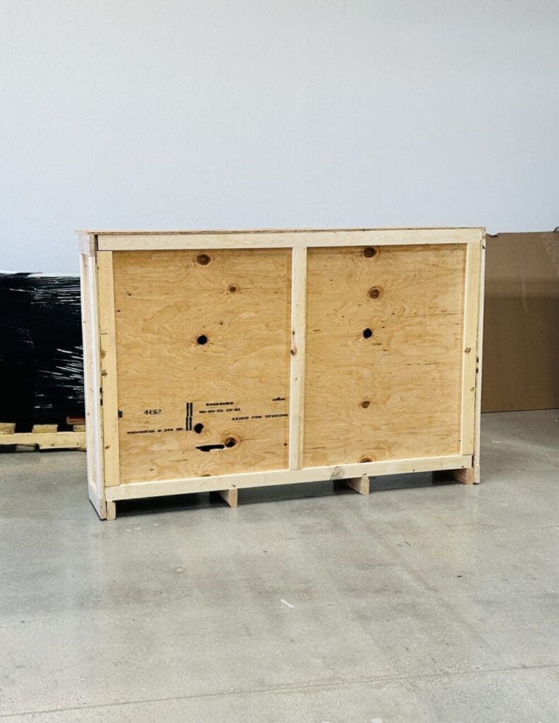 Craftsman assembling a custom wooden crate in Las Vegas for safe nationwide shipping.